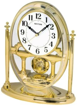 Rhythm Pendule à Poser Dorée Sur Socle En Plastique