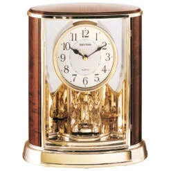 Rhythm Pendule à Poser Animée Balancier Rotatif